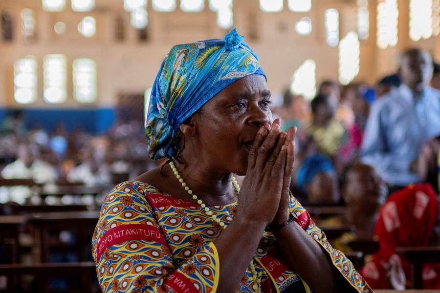 A woman attends a Catholic Mass after members of the Alliance Fleuve Congo AFC-M23 Movement took over Uvira town from the Armed Forces of the Democratic Republic of the Congo (FARDC), in Uvira, on the shores of Lake Tanganyika, in South Kivu province, in the Democratic Republic of Congo December 14, 2025. REUTERS/Stringer