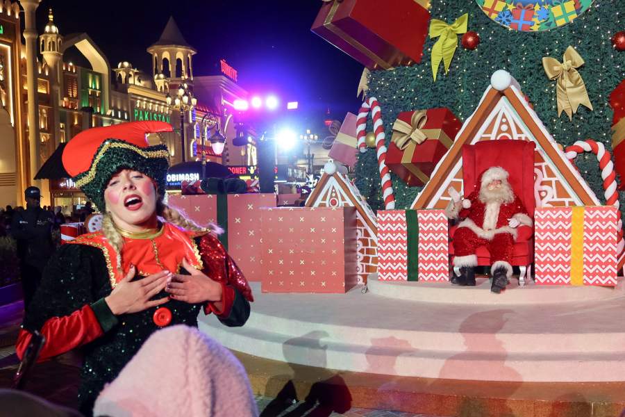 A person wearing a Christmas-themed outfit performs during a Christmas show in Dubai, United Arab Emirates, December 20, 2025. REUTERS/Abdelhadi Ramahi