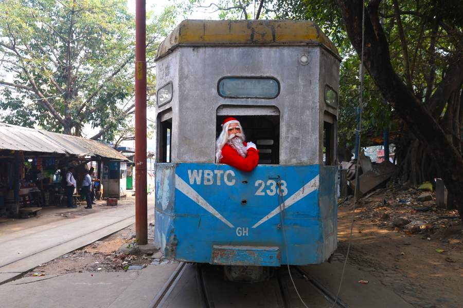 A man dressed as Santa Claus looks from a window of a tram ahead of Christmas in Kolkata, India, on December 10, 2025. (Photo by Rupak De Chowdhuri/NurPhoto via Getty Images)