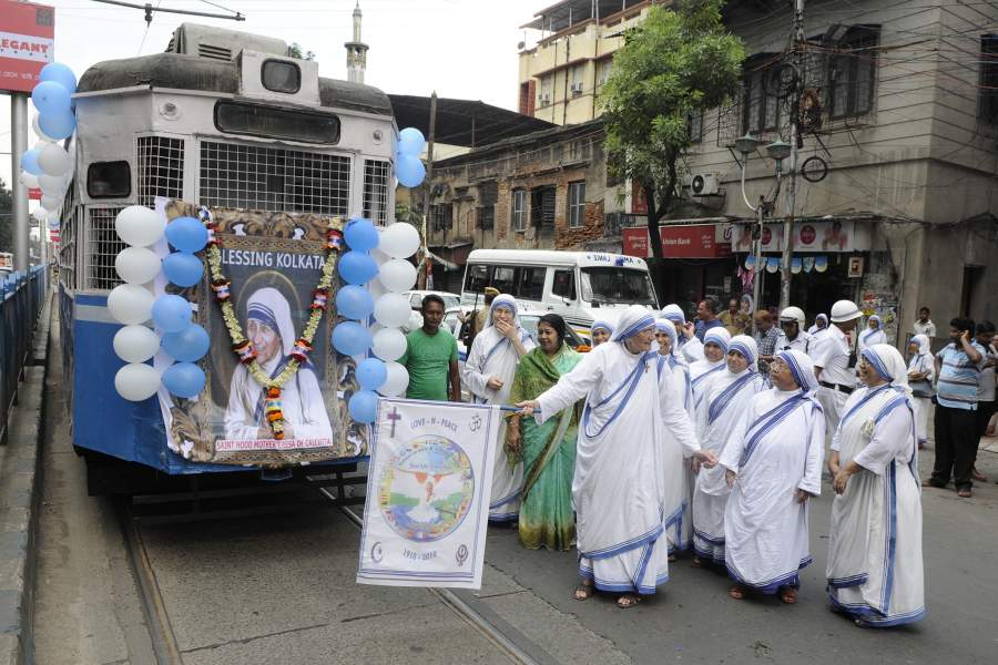 KOLKATA, INDIA - SEPTEMBER 18: The tram decorated with Saint Mother Teresa’s pictures, posters, texts to mark canonization of Mother Teresa in front of Mother House, on September 18, 2016 in K