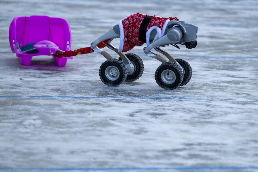 HARBIN, CHINA - JANUARY 01: A Unitree Robotics robot dressed in traditional Northeast China clothing at the Harbin Ice and Snow Carnival on January 01, 2026 in Harbin, China. (Photo by Tyne Chin/Getty Images)