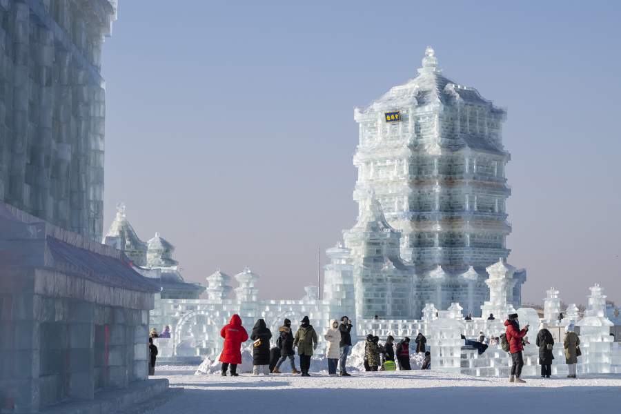 Tourists visit the 27th Harbin Ice and Snow World on December 17, 2025 in Harbin, Heilongjiang Province of China. The world's largest ice-and-snow theme park, the 27th edition of the Harbin Ice-Snow World, officially opened at 10 a.m. on December 17 in Harbin, the capital city of northeast China's Heilongjiang Province