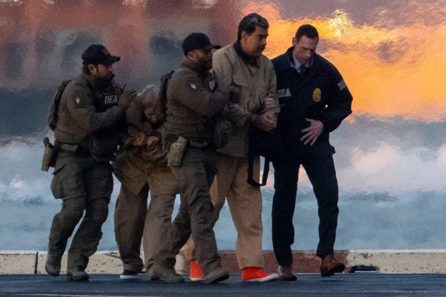 Captured Venezuelan President Nicolas Maduro and his wife Cilia Flores are escorted, as they heads towards the Daniel Patrick Moynihan United States Courthouse in Manhattan for an initial appearance to face U.S. federal charges including narco-terrorism, conspiracy, drug trafficking, money laundering and others, at Downtown Manhattan Heliport, in New York City, U.S., January 5, 2026. REUTERS/Adam Gray