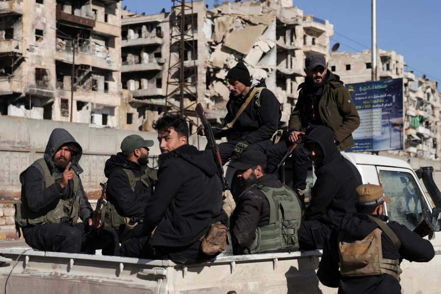 Members of the general security forces sit on a vehicle at the Sheikh Maksoud neighbourhood after taking control of the area, following the collapse of an agreement between the Syrian government and the Syrian Democratic Forces (SDF), in Aleppo, Syria, January 10, 2026. REUTERS/Khalil Ashawi