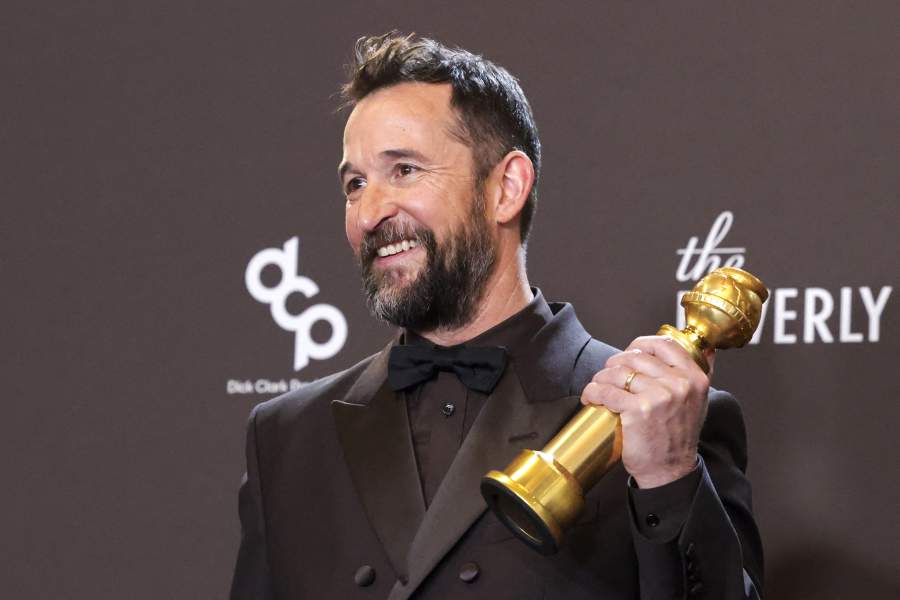 Noah Wyle poses with the Best Performance by a Male Actor in a Television Series