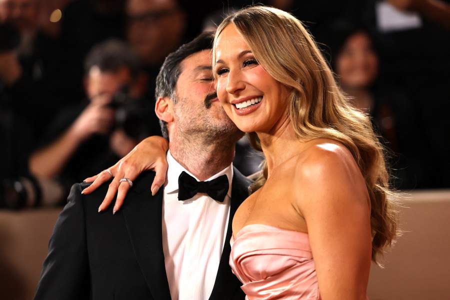 Nikki Glaser and Chris Convy pose on the red carpet at the 83rd Annual Golden Globes in Beverly Hills
