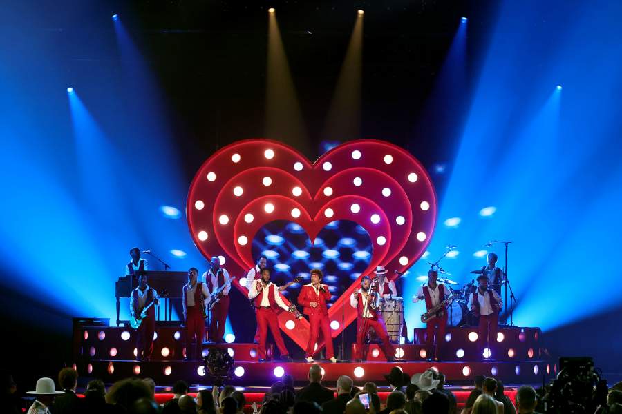 LOS ANGELES, CALIFORNIA - FEBRUARY 01: Bruno Mars (C) performs onstage during the 68th GRAMMY Awards at Crypto.com Arena on February 01, 2026 in Los Angeles, California. (Photo by Kevin Winter/Getty Images for The Recording Academy)