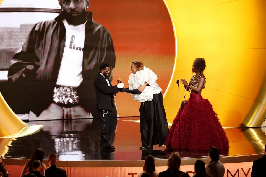 LOS ANGELES, CALIFORNIA - FEBRUARY 01: (FOR EDITORIAL USE ONLY) Kendrick Lamar (L) accepts the Best Rap Album award for "GNX" from Queen Latifah and Doechii onstage during the 68th GRAMMY Awards at Crypto.com Arena on February 01, 2026 in Los Angeles, California. (Photo by JC Olivera/WireImage)