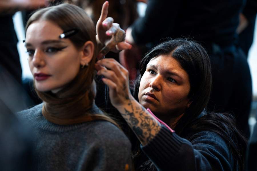 A model gets prepared for Christian Siriano's Fall/Winter 2026 collection show with the show’s signature “surreal swoop” of hair during New York Fashion Week in New York City, U.S., February 12, 2026. REUTERS/Angelina Katsanis