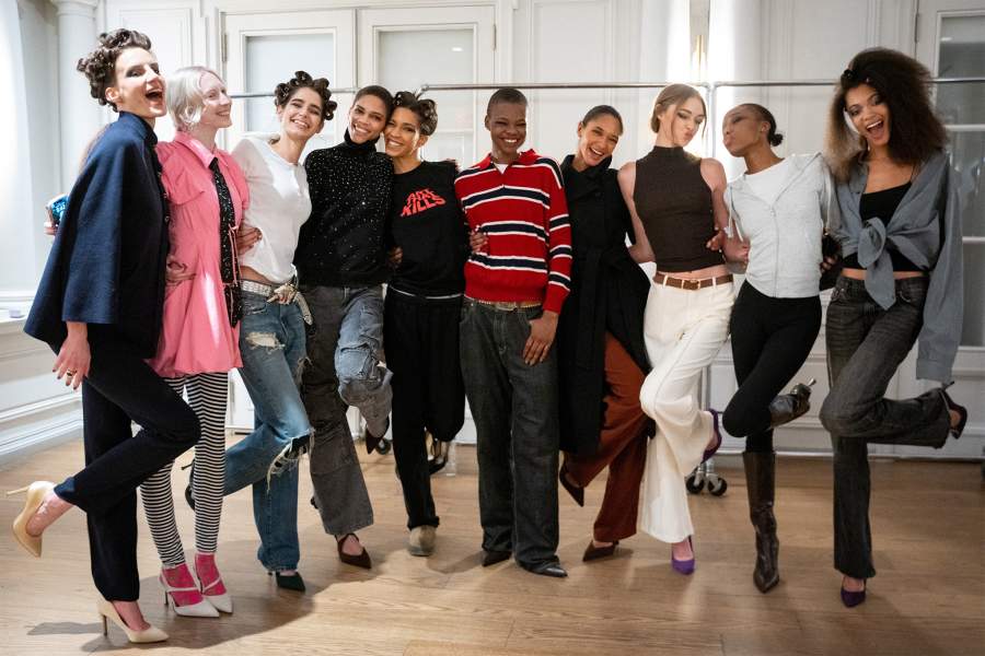 Models pose in their rehearsal clothes backstage before the Bibhu Mohapatra Fall and Winter 2026 collection show during New York Fashion Week in New York City
