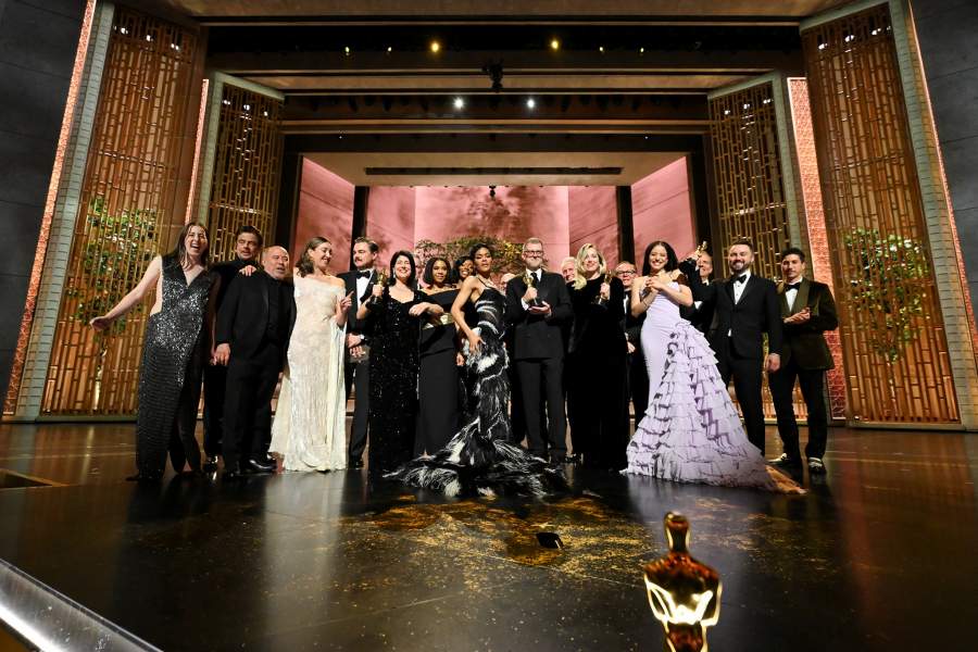Director Paul Thomas Anderson and cast members pose after winning the Oscar for Best Picture for "One Battle after Another" at the 98th Academy Awards in Hollywood, Los Angeles, California, U.S., March 15, 2026.