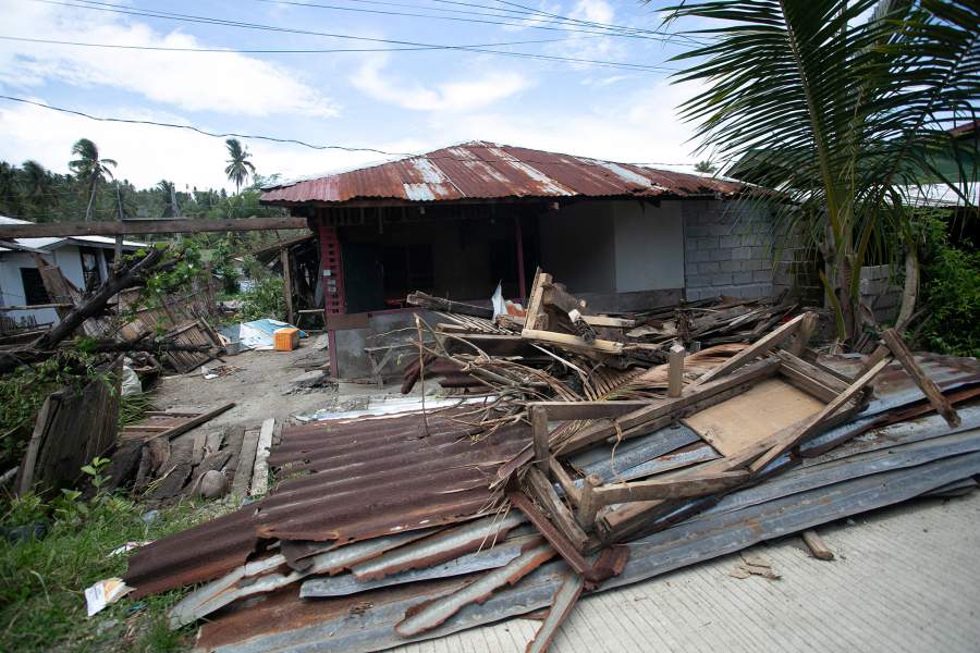 Debris from a damaged house is scattered along the road following the magnitude 7.8 quake on the coast of Glan, Sarangani Province, southern Philippines, June 10, 2026. REUTERS/Manman Dejeto
