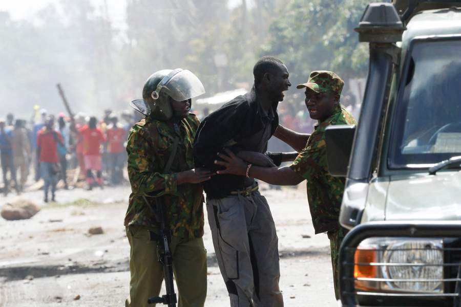 Riot police officers detain a demonstrator during a protest against a U.S.-backed Ebola quarantine plan to establish a 50-bed facility at a Kenyan air force base intended to host Americans exposed to Ebola, in Nanyuki town, Laikipia County, Kenya, June 9, 2026. REUTERS/Monicah Mwangi