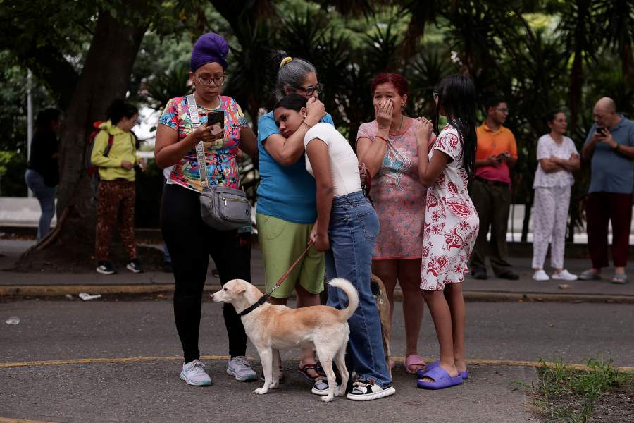 People react as they gather after an earthquake, in Caracas, Venezuela, June 24, 2026