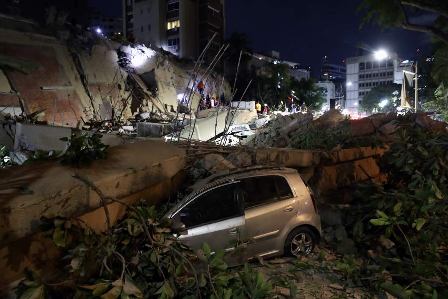 A damaged vehicle lies beneath rubble in Caracas, Venezuela, 24 June 2026