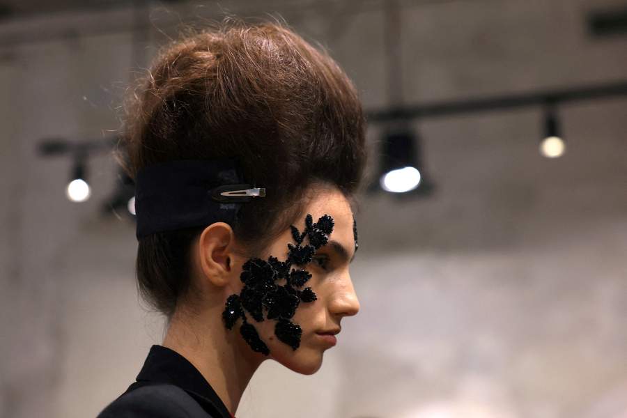 A model gets ready backstage wearing a creation from the Antonio Marras Spring/Summer 2027 collection during Fashion Week in Milan, Italy, September 23, 2026. 