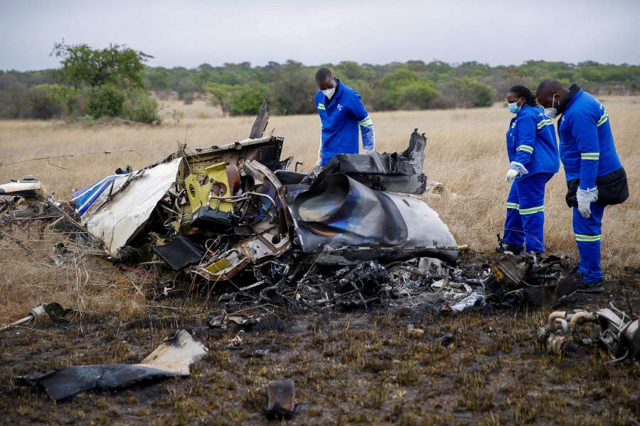 Officials work at the site of a helicopter crash at Kudenga Farm in the Marondera rural area, east of Harare, Zimbabwe, October 1, 2026. REUTERS/Philimon Bulawayo TPX IMAGES OF THE DAY