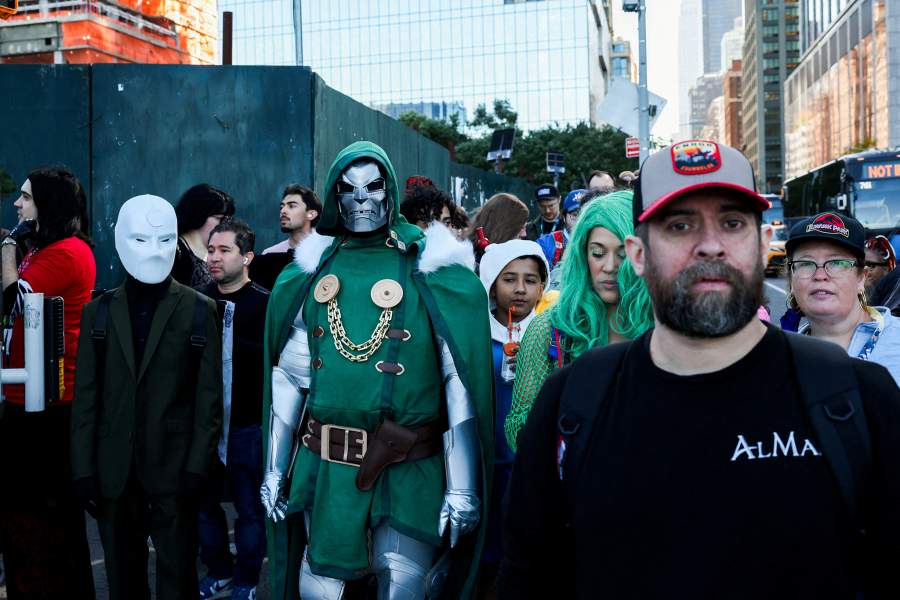 People wearing costumes wait to cross the street during the opening day of New York Comic Con outside the Jacob Javits Center in Manhattan in New York City, U.S., October 8, 2026.
